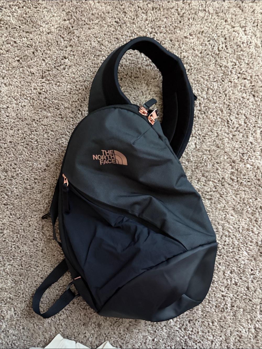 The North Face Black Sling Bag with Rose Gold Accents